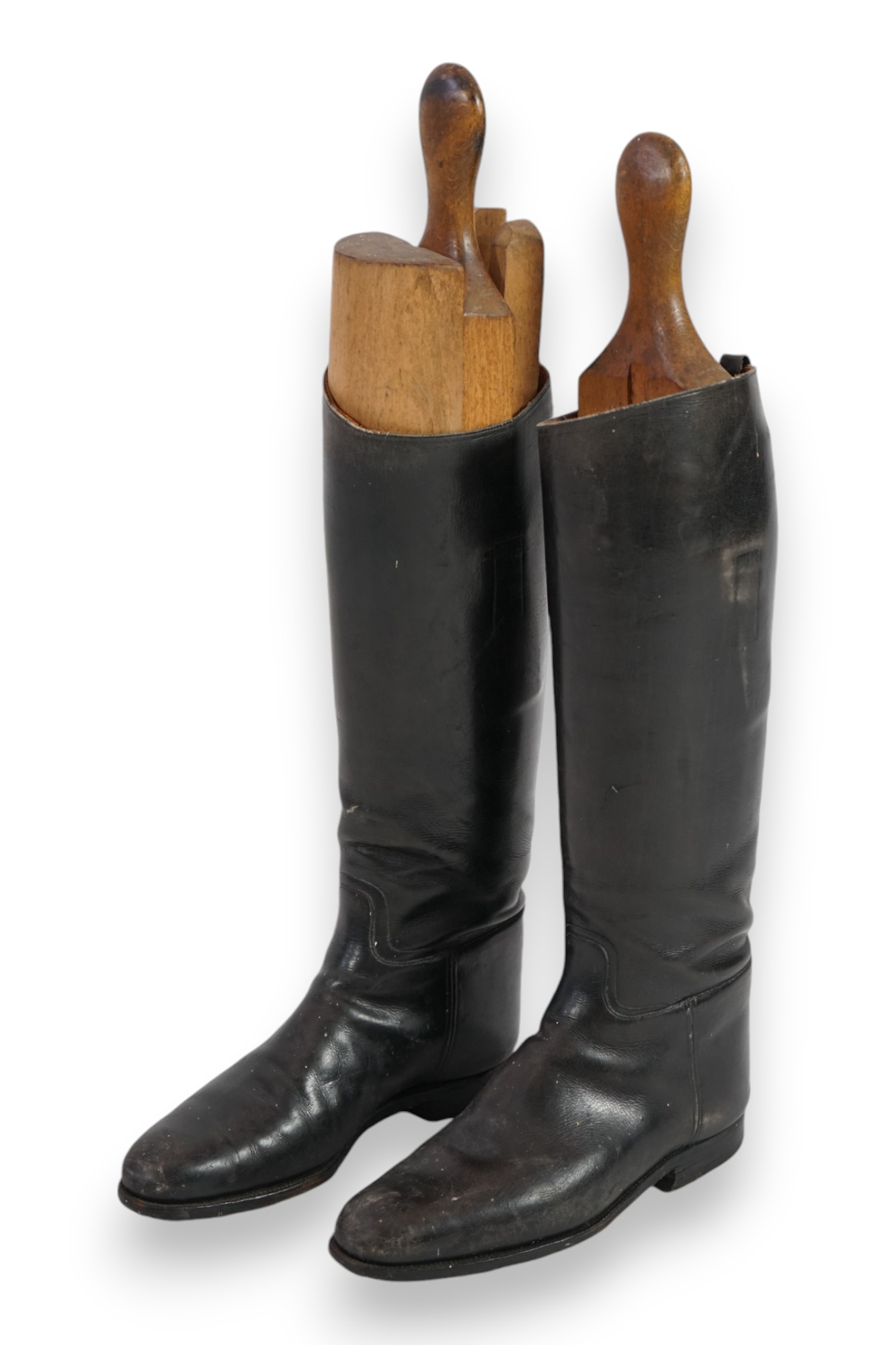 A pair of black leather riding boots